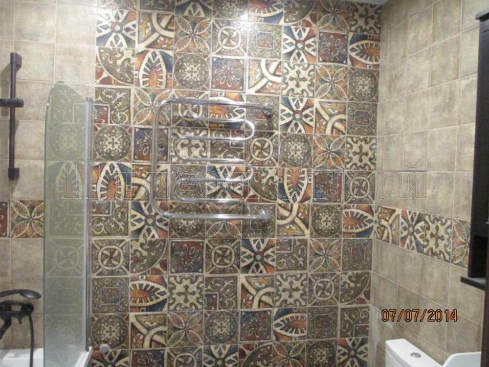 Укладка плитки на стенах  ванной комнате ИллеонСтрой 